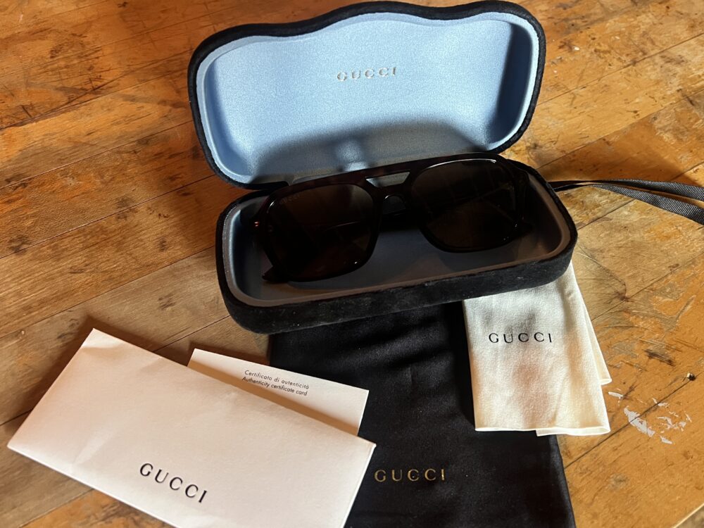 “Casie Stewart wearing Gucci sunglasses in winter Toronto”
“Gucci GG1823SA Asian Fit sunglasses close-up”
“Designer sunglasses styled with winter coat”
“SmartBuyGlasses Gucci packaging and dust bag”