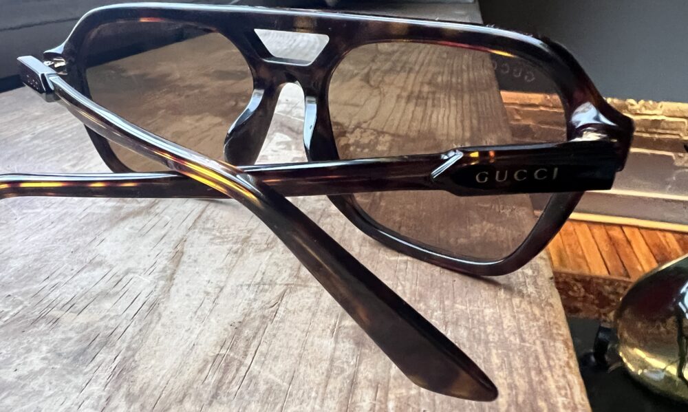 “Casie Stewart wearing Gucci sunglasses in winter Toronto”
“Gucci GG1823SA Asian Fit sunglasses close-up”
“Designer sunglasses styled with winter coat”
“SmartBuyGlasses Gucci packaging and dust bag”